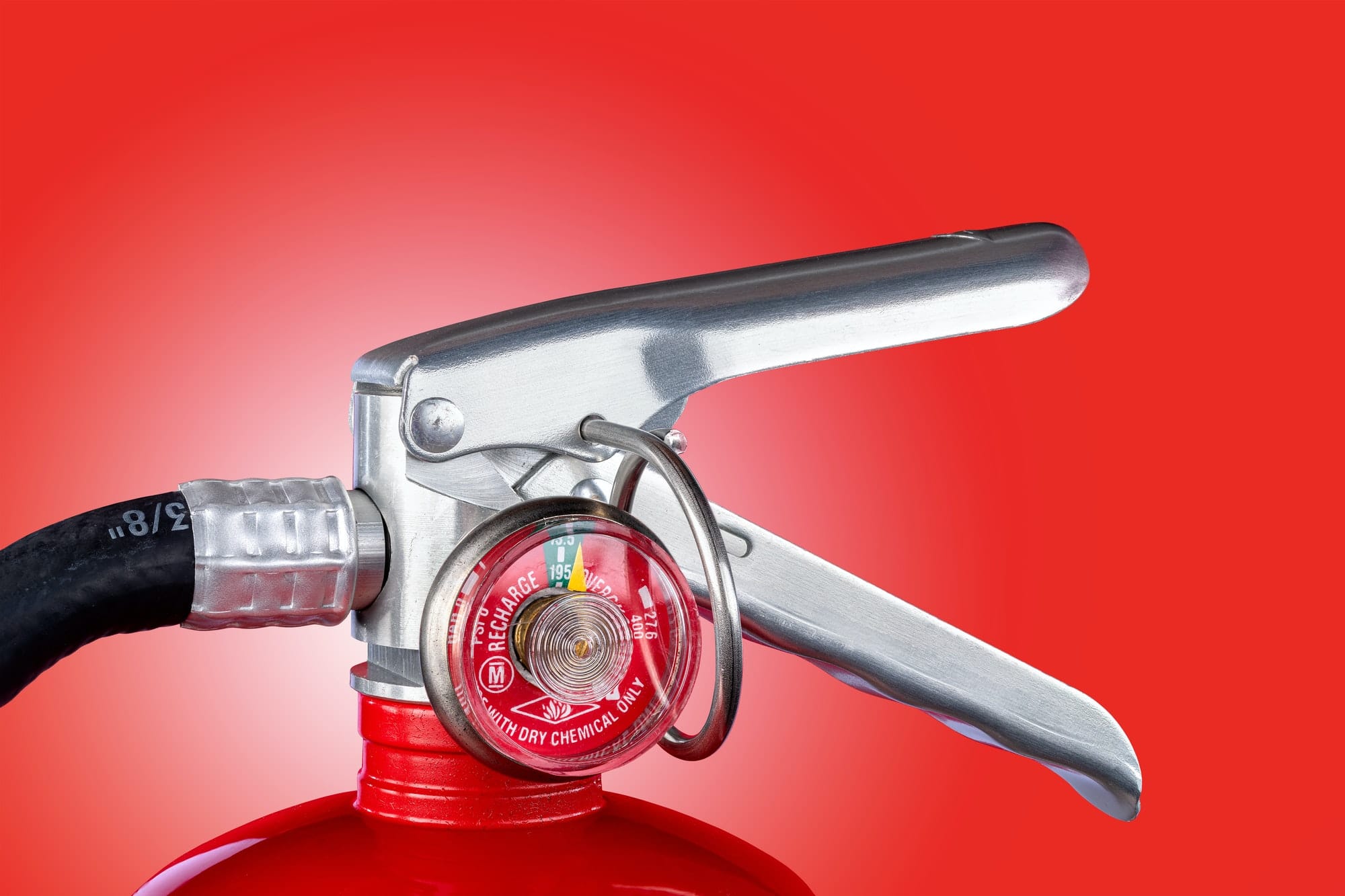 Fire extinguisher valve on red